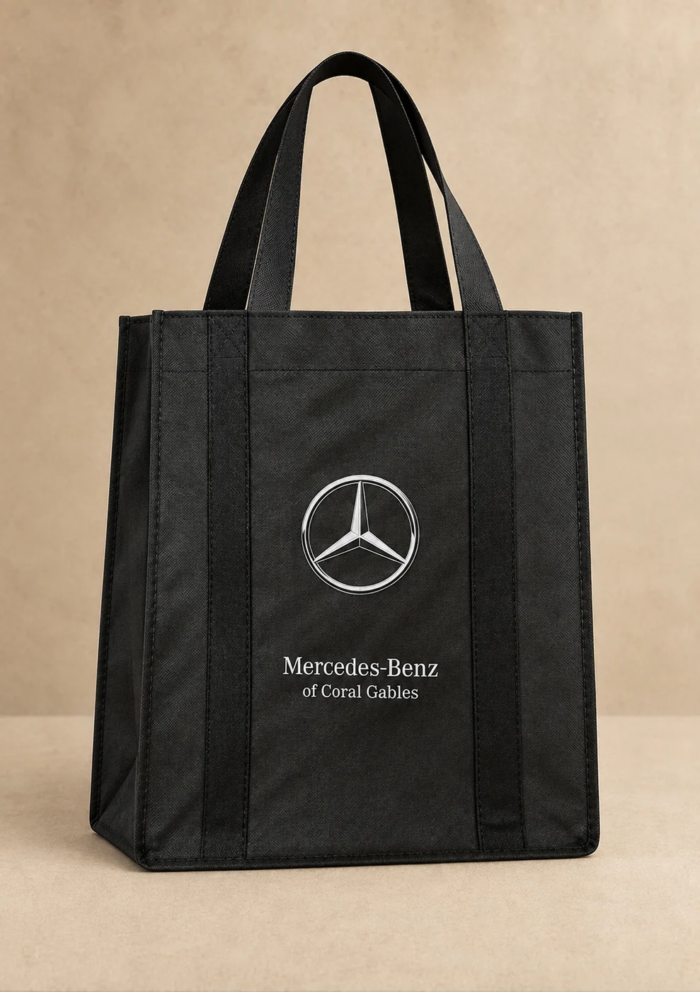 Black tote bag with a printed white logo